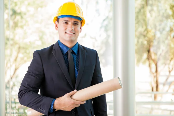 Architect carrying blueprints — Stock Photo, Image