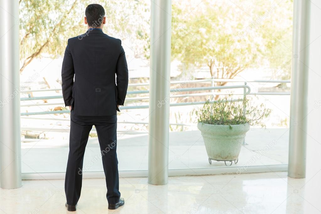 Businessman looking outside