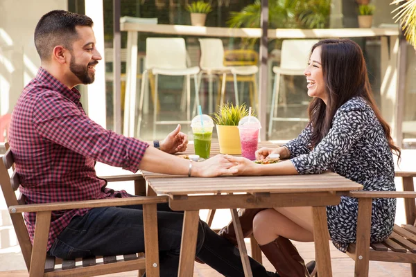 Young couple holding hands — Stock Photo, Image