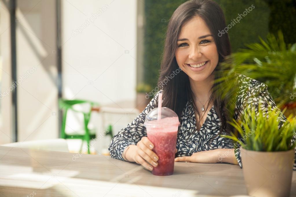 Woman having healthy smoothie