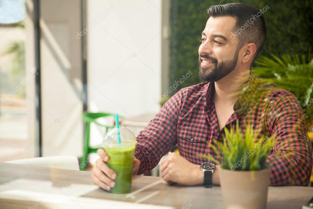 man enjoying healthy smoothie