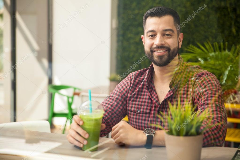Man drinking a healthy smoothie