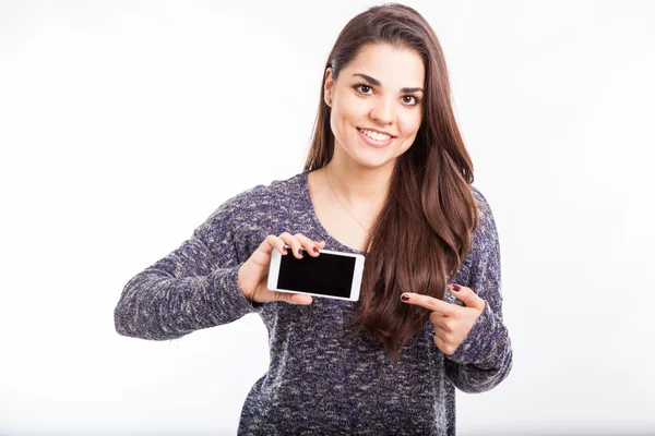 Brunette pointing on smartphone — Stock Photo, Image