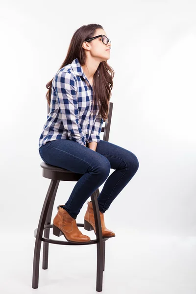 Girl sitting on a chair — Stock Photo, Image