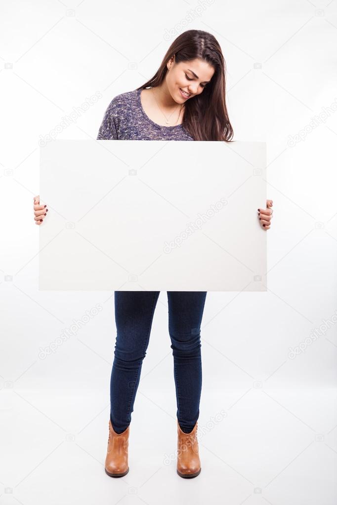 Woman holding a white sign