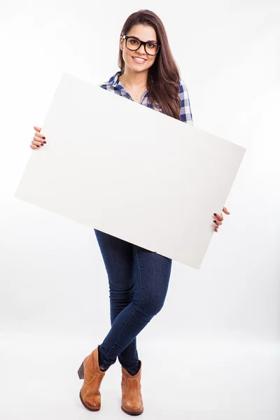 Woman holding a big white sign — Stock Photo, Image