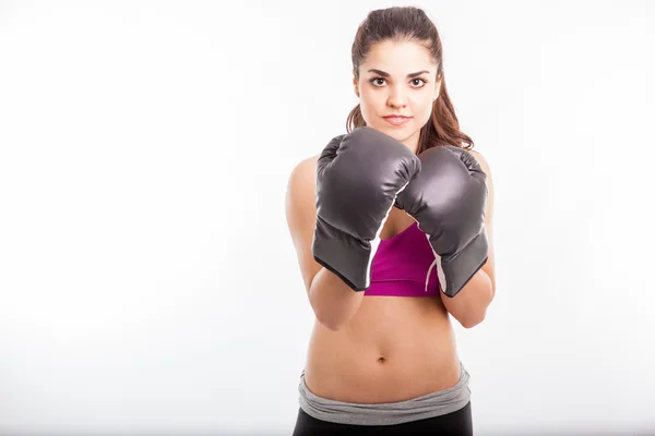 Woman wearing boxing gloves — Stock Photo, Image