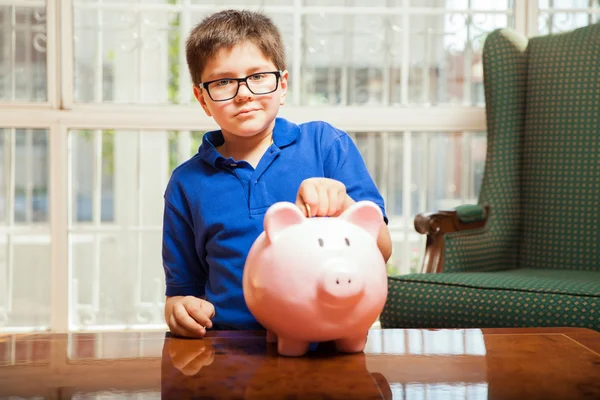 Kid dropping a coin — Stock Photo, Image