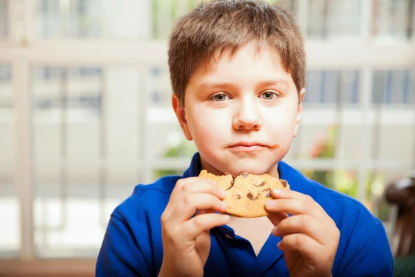 boy enjoying  cookie
