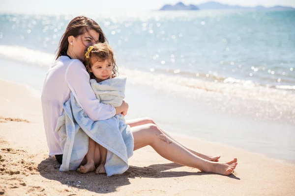 Girl being embraced  by her mother — Stock Photo, Image