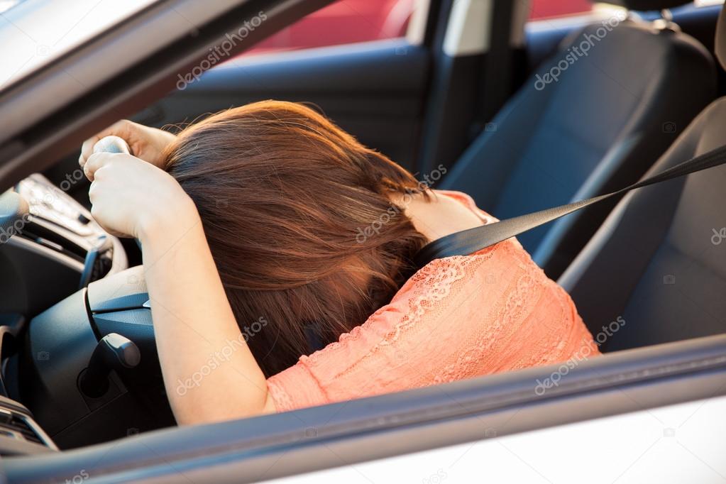 leaning on steering wheel Stock Photo by ©tonodiaz 71584989