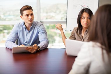 workers interviewing a woman