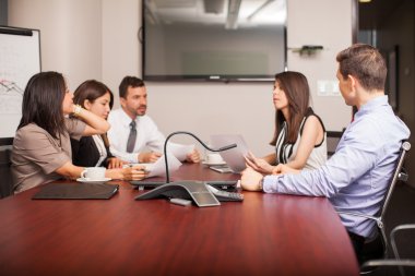 people sitting  in a meeting room