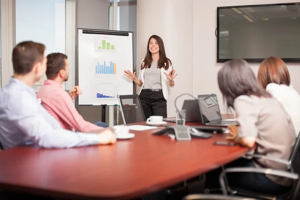 Brunette giving a business presentation — Zdjęcie stockowe