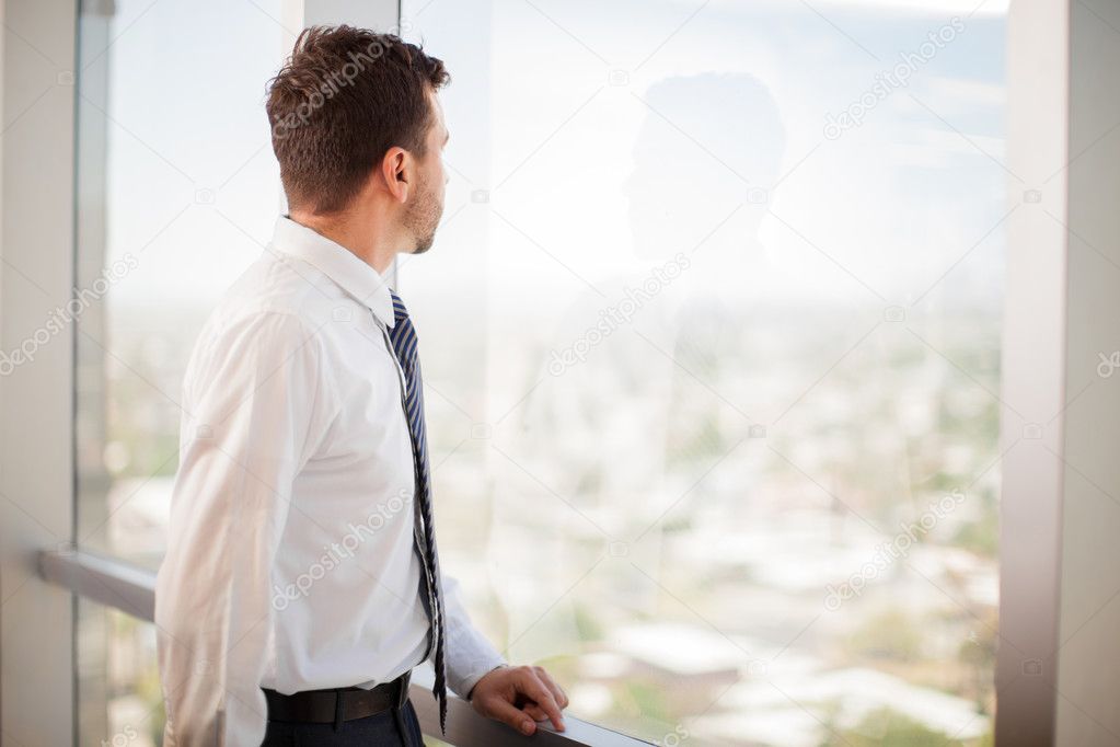 Businessman looking outside