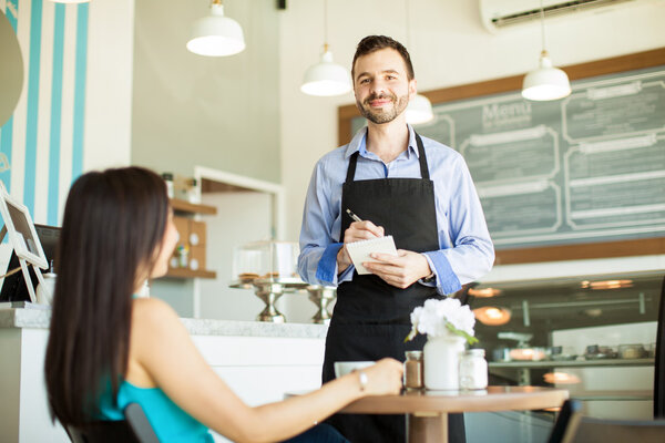 waiter taking a woman's order
