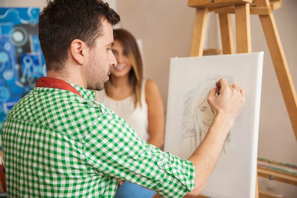 Artist drawing a portrait — Stock Photo, Image