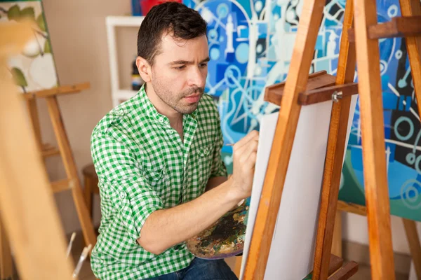 Artist focused on his latest painting — Stock Photo, Image