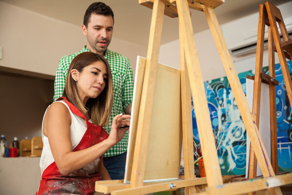 woman working on a painting