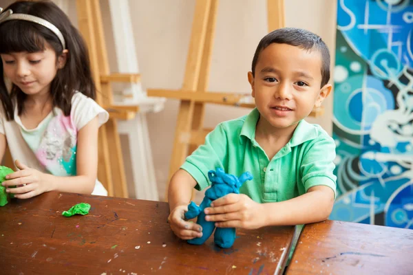 Boy using clay — Stock Photo, Image