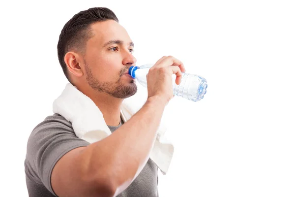 Man with a beard drinking water — Stock Photo, Image