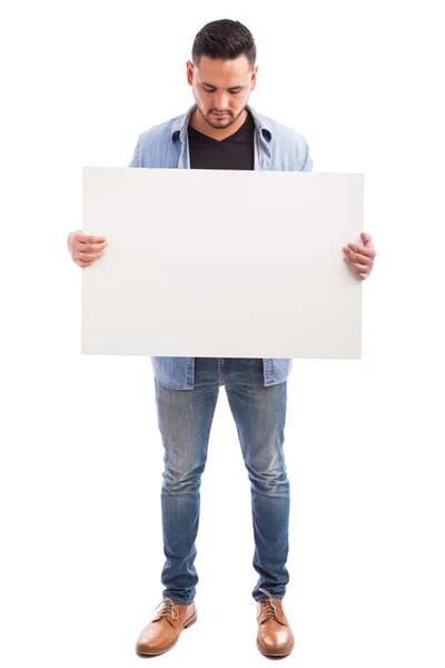 Man holding a big sign — Stock Photo, Image