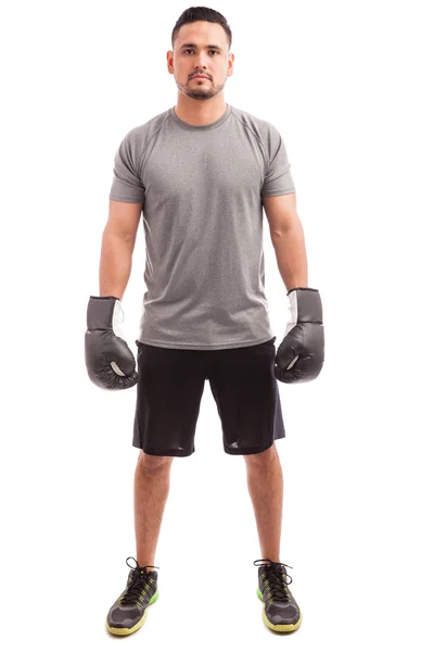 Man wearing boxing gloves and standing — Stock Photo, Image