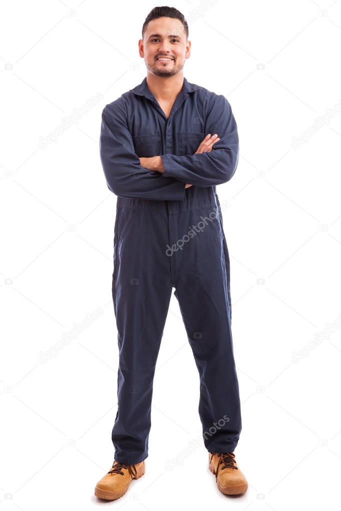 mechanic wearing overalls and smiling