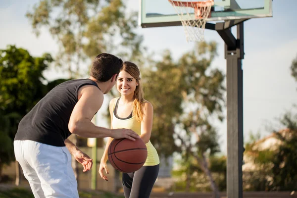 Brunette trying to steal the ball — Stock Photo, Image