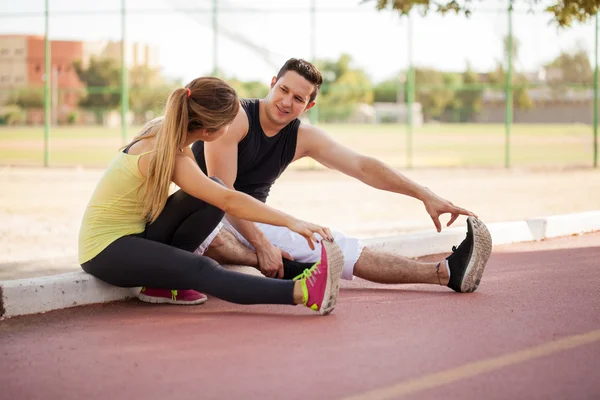 Couple stretching their legs — Stock Photo, Image