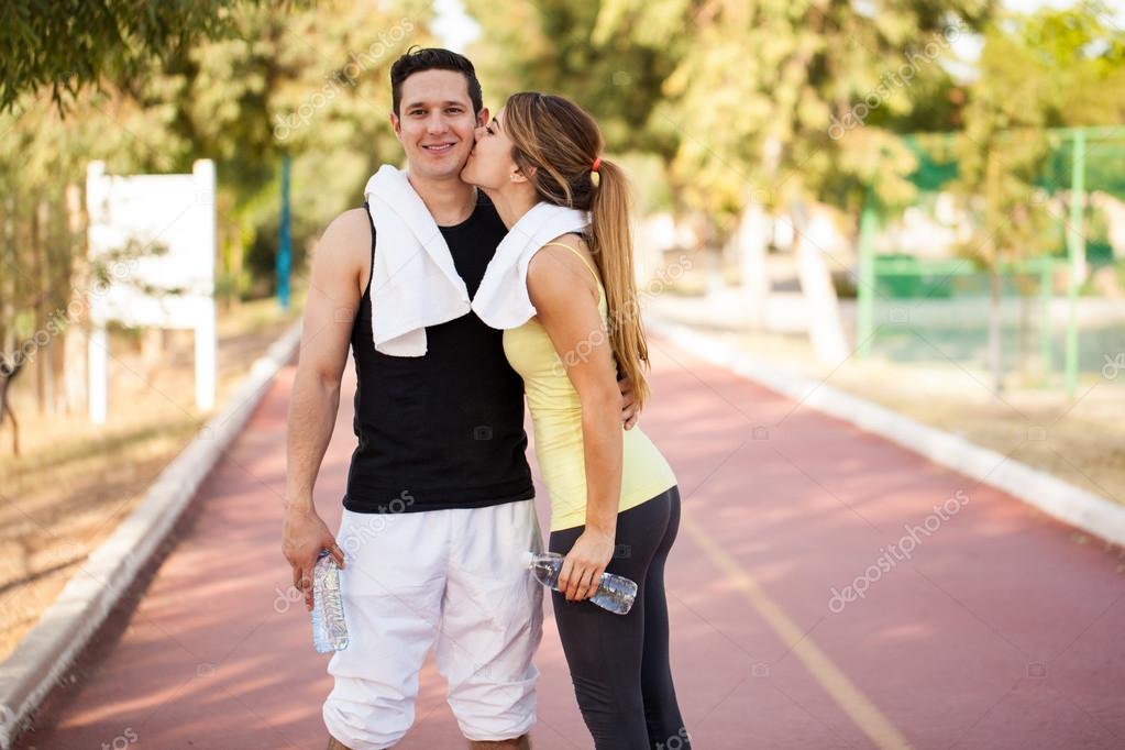 Man in sporty outfit getting a kiss Stock Photo by ©tonodiaz 89600162