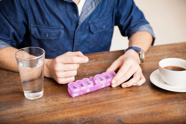 Man getting his daily vitamins — Stock Photo, Image