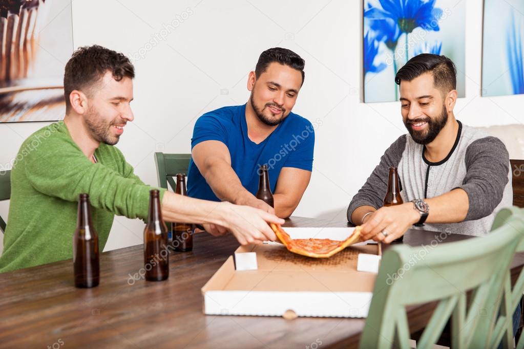 Friends eating  and drinking beer