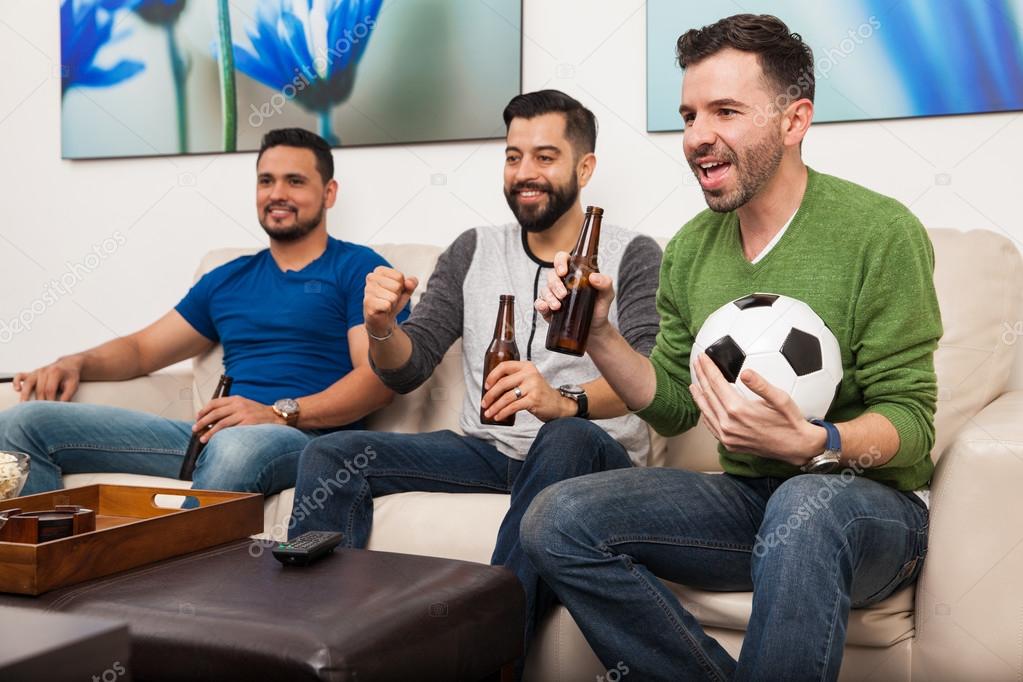 men watching a soccer game