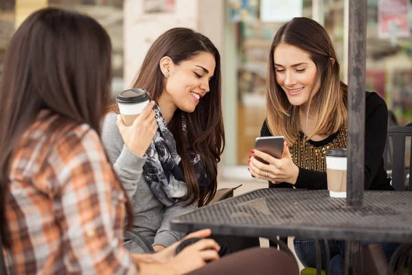 Brunette showing a picture — Stock Photo, Image