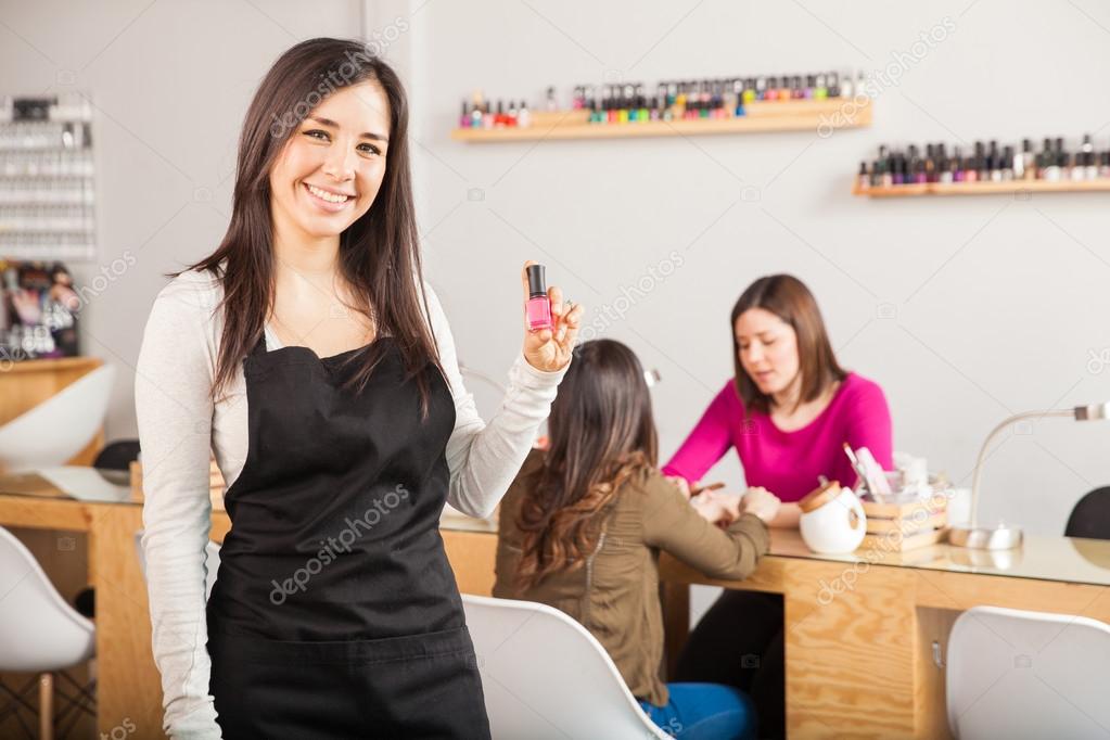 brunette holding a nail polish