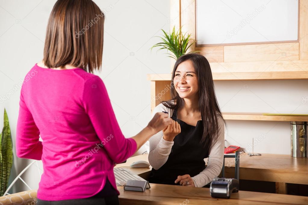 woman  taking a credit card