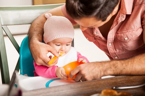 Baby girl being fed — Stock Photo, Image