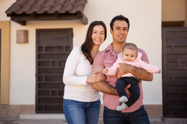Couple and their baby girl standing Royalty Free Stock Photos