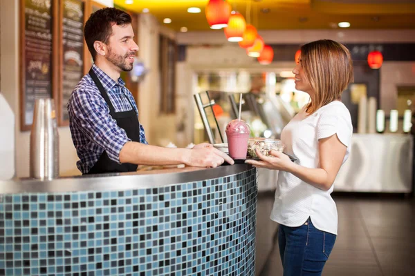 Employee giving a tray — Stock Photo, Image