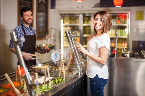 Brunette choosing the ingredients — Stock Photo, Image