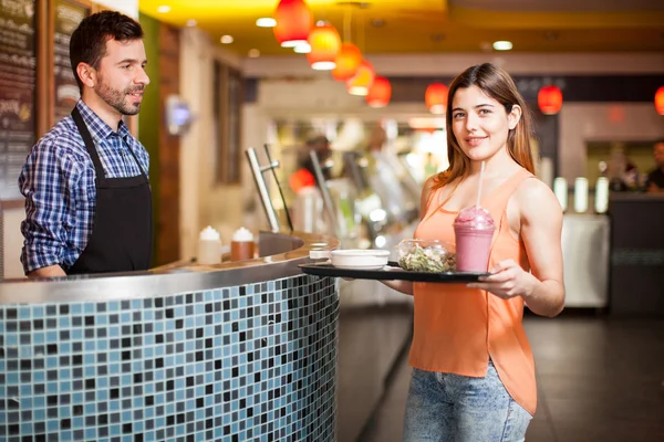 Brunette holding a tray — Stock Photo, Image