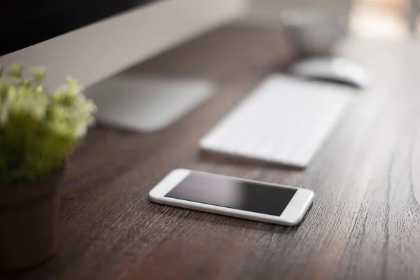 Workspace with a computer and a smartphone — Stock Photo, Image