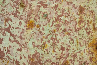 Yerde paslı bir metal parçası var. Arkaplan