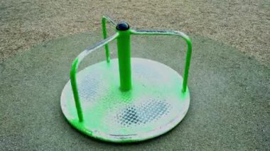 Empty carousel in the playground. Children at school. Closed due to coronavirus, pondemic