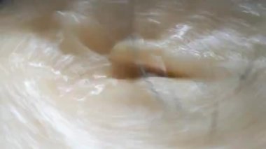 Close-up of a mixer that beats ingredients to prepare a dish