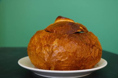 There is a soup bun on the plate