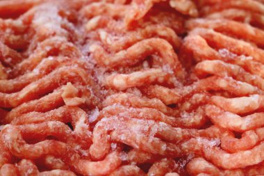 Frozen red fresh minced meat. Background, texture of food