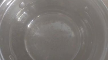 Top view of a saucepan while boiling water