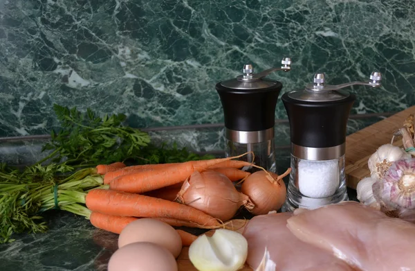 Carrots, onions, eggs, chicken and spices — Stock Photo, Image